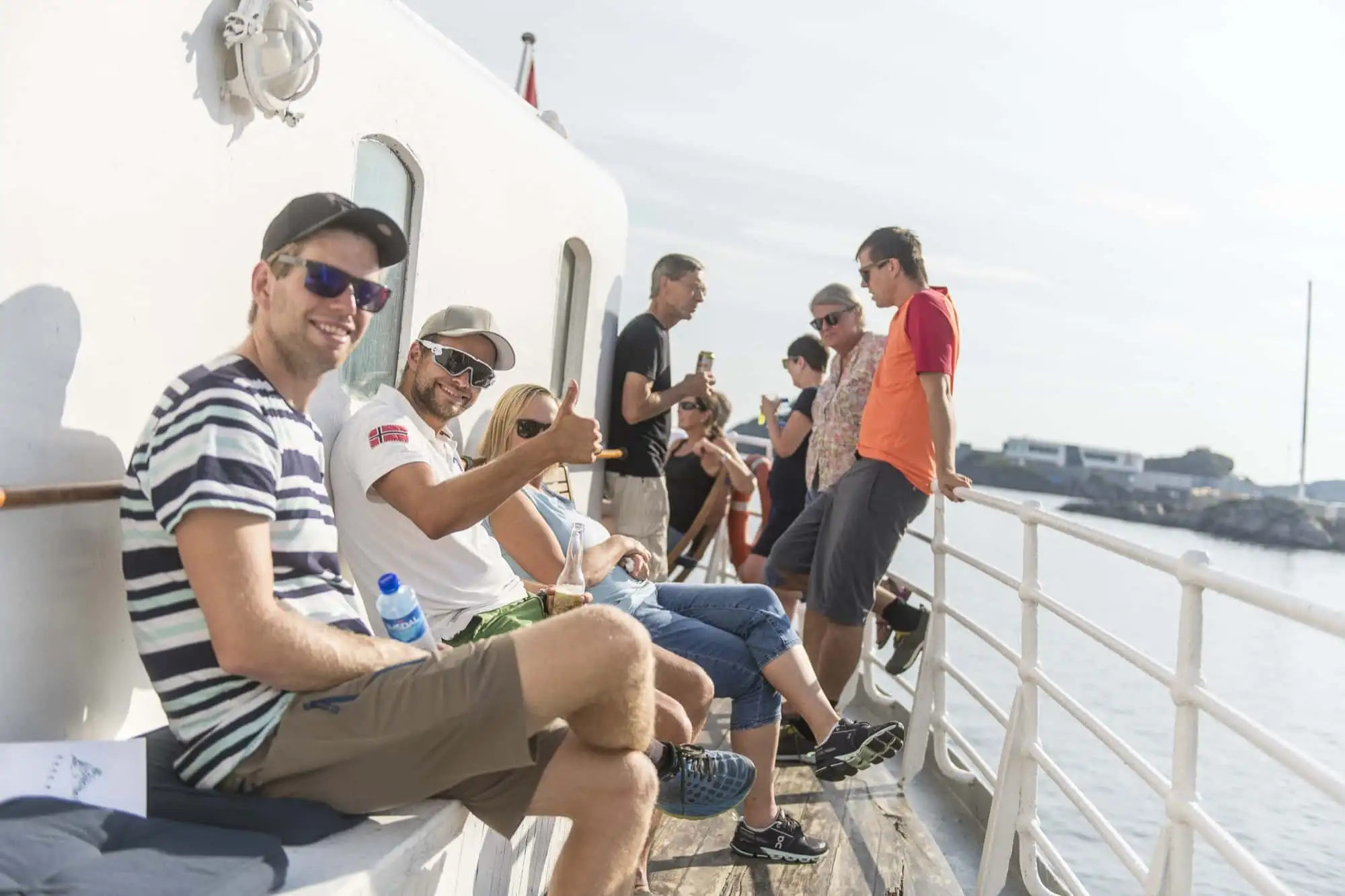 Lofoten feelgood out on the deck of MS Gamle Salten. – Norwegian Adventure Company