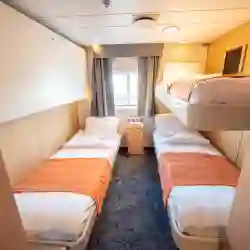 The triple cabin (4) have three single beds, one of which is a bunk bed, wardrobes and a private bathroom with shower and toilet. – Norwegian Adventure Company