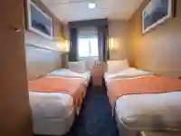 Twin cabins (4) have two single beds, a window, one wardrobe and are slightly smaller than twin cabins plus. Also with a private bathroom with shower and a toilet. – Norwegian Adventure Company