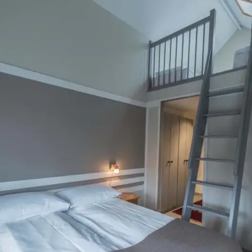 Double room/village views with loft (4 pers). Can be shared by 4 good friends or a family of 4. – Norwegian Adventure Company
